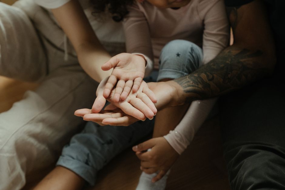 Close-up of diverse family hands symbolizing connection and warmth.